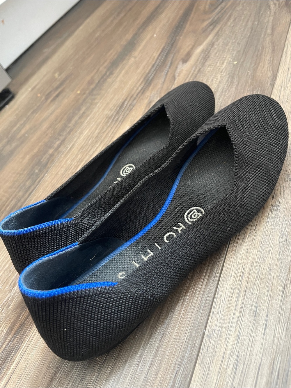 Rothy’s Black Knit Slip-On Flats with Blue Trim